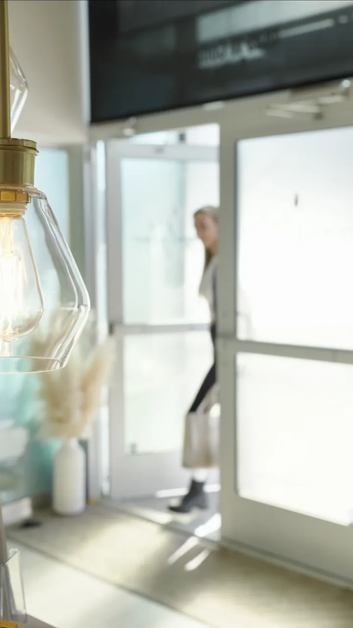 A patient walking into the Original Glam clinic
